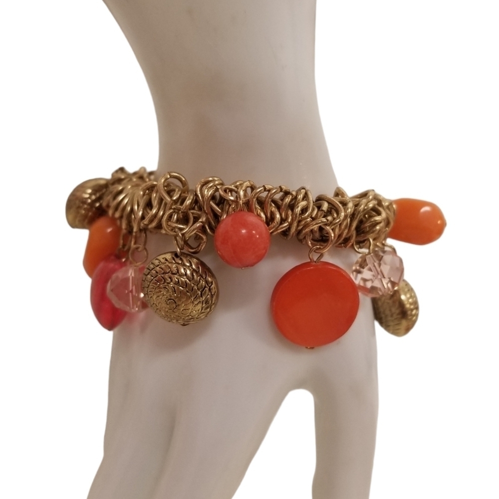 GOLDTONED STRETCH BRACELET WITH BOLD ORANGE & RED GLASS & ACRYLIC CHARMS
